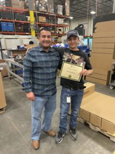 Trevin Steele receiving employee of the month